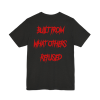 DailyThreadCo. black cotton t-shirt featuring bold red jagged text on the back reading BUILT FROM WHAT OTHERS REFUSED