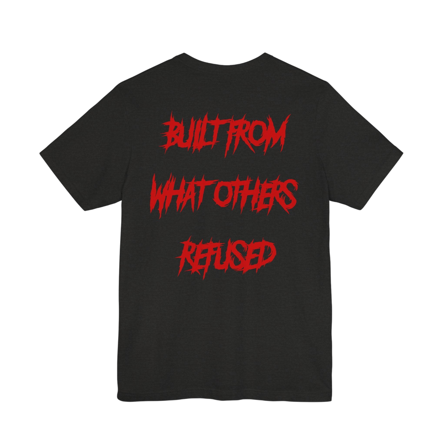 DailyThreadCo. black cotton t-shirt featuring bold red jagged text on the back reading BUILT FROM WHAT OTHERS REFUSED