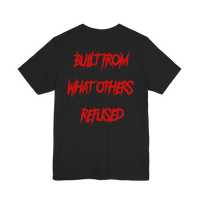 DailyThreadCo. black cotton t-shirt featuring the bold red text BUILT FROM WHAT OTHERS REFUSED on the back