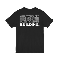 DailyThreadCo. black cotton t-shirt featuring a bold white typographic manifesto on the back.