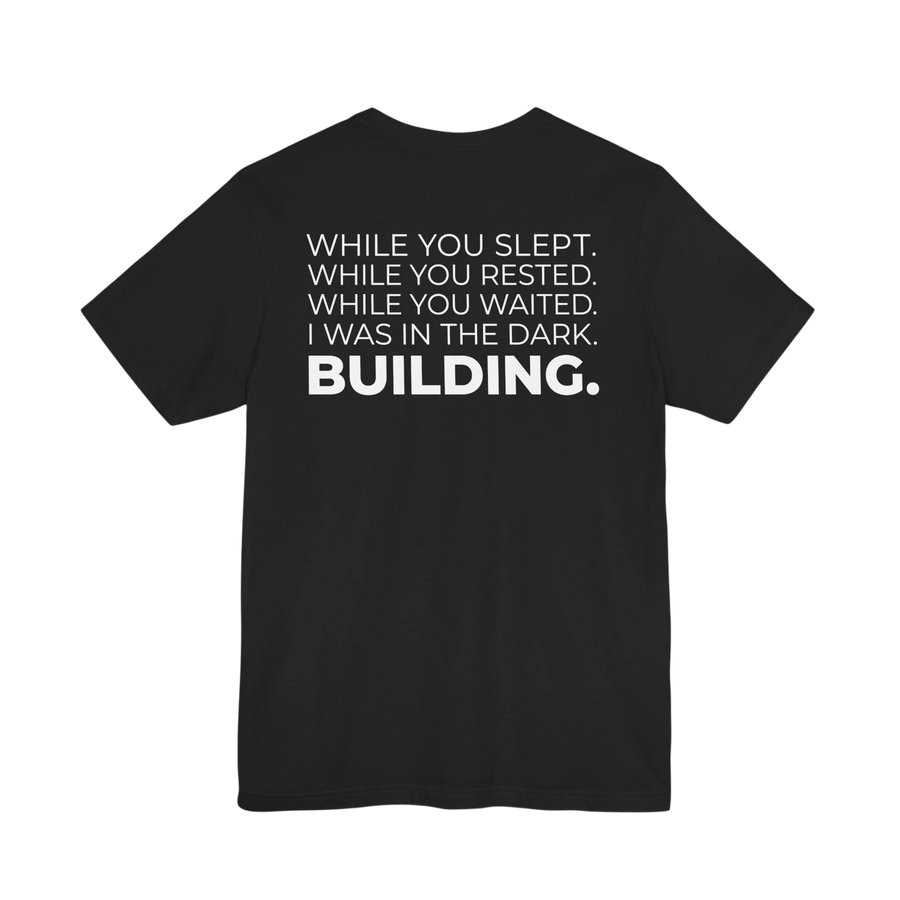 DailyThreadCo. black cotton t-shirt featuring a bold white typographic manifesto on the back.