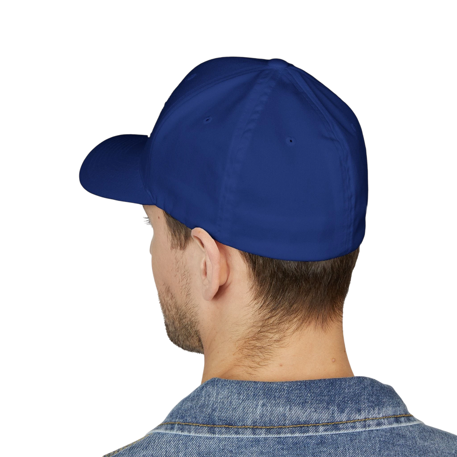 DailyThreadCo. blue structured FlexFit cap worn by a man, showing the clean, closed-back design from behind.
