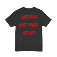 DailyThreadCo. charcoal grey cotton t-shirt featuring bold red jagged text on the back reading Built From What Others Refused.