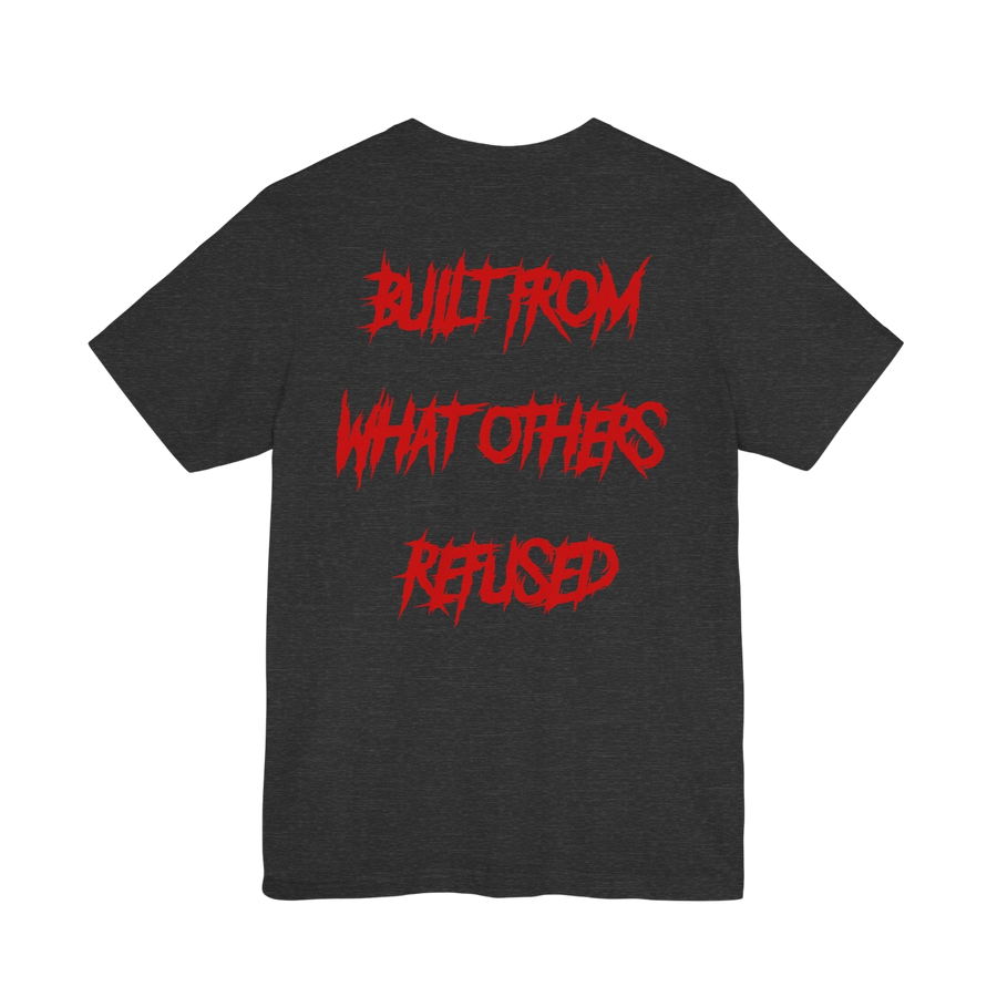 DailyThreadCo. charcoal grey cotton t-shirt featuring bold red jagged text on the back reading Built From What Others Refused.