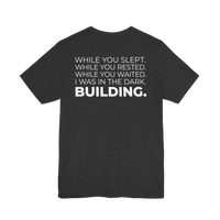 DailyThreadCo. charcoal grey cotton t-shirt with white motivational typography on the back.