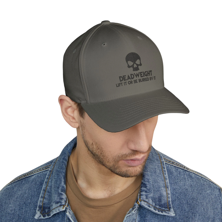DailyThreadCo. black structured cap with skull embroidery and Deadweight text worn by a man in a denim jacket.