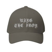 DailyThreadCo. structured FlexFit cap in grey twill with white gothic Bang the Iron embroidery on the front.