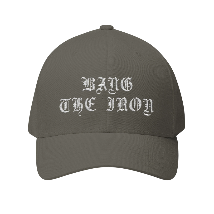 DailyThreadCo. structured FlexFit cap in grey twill with white gothic Bang the Iron embroidery on the front.