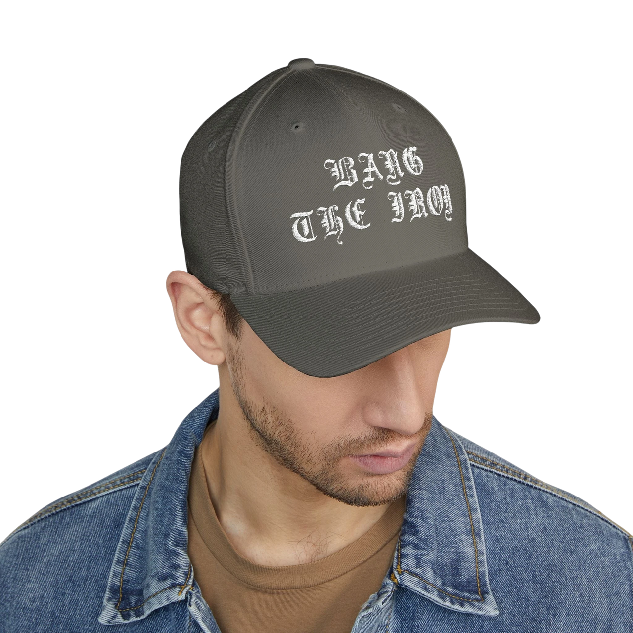 DailyThreadCo. structured grey FlexFit cap with white Bang the Iron gothic embroidery worn by a man in a denim jacket.