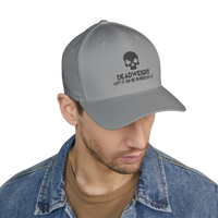 DailyThreadCo. grey structured cap with a skull embroidery and Deadweight slogan worn by a man in a denim jacket.