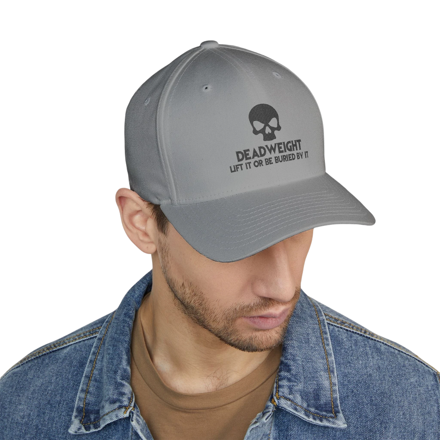 DailyThreadCo. grey structured cap with a skull embroidery and Deadweight slogan worn by a man in a denim jacket.