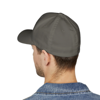 A man wearing a DailyThreadCo. grey structured six-panel FlexFit cap from the back, showing a clean, solid design.