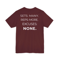 DailyThreadCo. maroon fitness t-shirt featuring the white printed mantra Sets: Many. Reps: More. Excuses: None. on back.