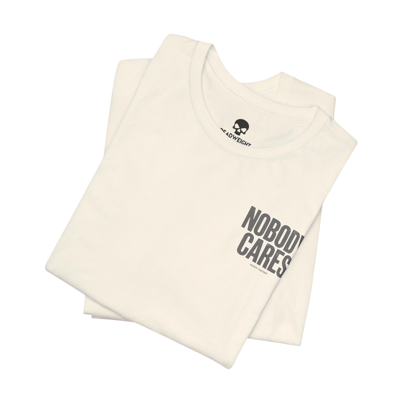 DailyThreadCo. Nobody Cares graphic tee in cream cotton with black text, featuring a crew neck and retail fit.