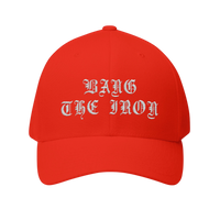 DailyThreadCo. red structured FlexFit cap with Bang the Iron embroidered in white gothic lettering on the front.