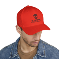 DailyThreadCo. red structured cap with black skull embroidery and Deadweight text on a man in a denim jacket.