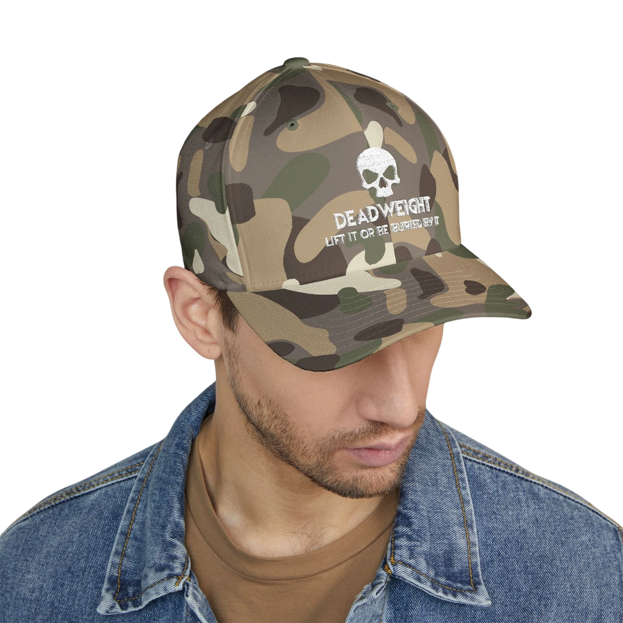 deadweightgymapparel. camo flexfit cap with distressed skull embroidery and Deadweight text on a man in a denim jacket.