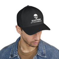 deadweightgymapparel. black flexfit cap with white embroidered distressed skull and Deadweight text on a man in denim jacket